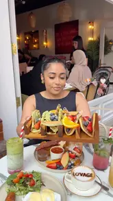 A short, energetic review of Lovage Bistro in North London, highlighting their unique pancake tacos and other brunch offerings. The creator provides a personal recommendation, showcasing the food, drinks, and interior decor.