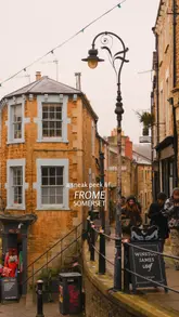 A travel-focused montage showcasing the aesthetic streets, independent shops, and atmosphere of Frome, Somerset, including a brief glimpse of a cafe interior.
