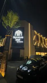 Here are a few options for your SEO alt text (all under 125 characters):

**Option 1 (Descriptive):**
Luxury interior of the newly opened Signature Mall in Bradford, featuring gold detailing and marble floors.

**Option 2 (Action-oriented):**
Shoppers exploring the new Dubai-style Signature Mall in Bradford featuring luxury fashion and a food court.

**Option 3 (Concise):**
Stunning interior design at the new Signature Mall in Bradford, offering a luxury shopping and dining experience.

**SEO Tip:** If the image shows a specific part of the mall (e.g., the food court or a specific clothing store), use that as the primary focus in the text.