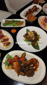 A high-quality montage video showcasing the interior and various dishes at Ava Steakhouse. The video features smooth, cinematic shots of steaks, mixed grills, sides, and cocktails, emphasizing the presentation and upscale atmosphere of the venue.