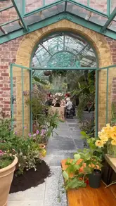 A visually stunning montage showcasing a press event at The Newt in Somerset, featuring a beautifully decorated greenhouse dining setup, rosé wine, and sorbet lollies amidst lush gardens.