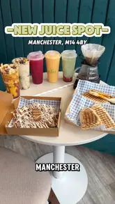 A fast-paced, first-person review of a new juice and dessert spot in Manchester. The creator walks the viewer through the venue, highlighting various smoothies, juices, paninis, waffles, and tiramisu options, providing a clear overview of the menu and the casual atmosphere.