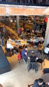 Here are a few options for your SEO alt text, depending on what the photo actually shows:

**Option 1 (Focus on the space):**
Spacious and modern interior seating area at Hatters Food Hall in Denton featuring comfy sofas and a stylish coffee corner.

**Option 2 (Focus on the food - if it's a flat lay):**
Delicious tapas including slow-cooked beef on brioche and Gambas al Pil Pil served at Hatters Food Hall in Denton.

**Option 3 (Focus on the Chicken Waffle):**
The viral chicken and waffle dish from Waffle Kart served at the new Hatters Food Hall in Denton.

**Option 4 (Broad/General):**
Various food dishes and modern seating at Hatters Food Hall, a dog-friendly dining destination in Denton. 

**SEO Tip:** If you have one primary image, choose the option that most accurately describes the main subject of that specific photo.