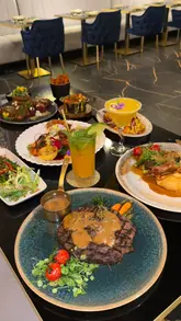 Since you didn't attach the specific image, I have provided a few options based on the context of your review. Please choose the one that best fits your photo:

**Option 1: If the image is of the food spread**
> "Delicious premium steak and seafood platter at AVA Grill, a luxury dining restaurant in Romford."

**Option 2: If the image is of the Dubai Chocolate Bomb/Dessert**
> "The viral Dubai Chocolate Bomb dessert being served at AVA Grill, a luxury steakhouse in Romford."

**Option 3: If the image is of the restaurant interior**
> "Modern and spacious interior dining area at AVA Grill, a luxury steakhouse located in Romford."

**Option 4: Generic/All-purpose**
> "Premium Wagyu beef and grilled dishes served at AVA Grill in Romford."

**SEO Tip:** Always include the location ("Romford") and the restaurant name ("AVA Grill") as these are high-intent keywords that will help your image rank in local search results.