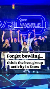 A promotional video for VR World in Basildon, featuring a group of people trying out various virtual reality experiences, including free-roaming team battles, simulators, and a VR treadmill. The video uses fast-paced editing and text overlays to highlight the fun and chaotic nature of the activity.