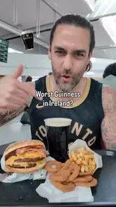 Here are a few options for your SEO alt text, keeping it under 125 characters:

**Option 1 (Descriptive):**
A pint of Guinness served on a tray next to a Burger King meal at an airport in Ireland.

**Option 2 (Focus on keywords):**
A glass of Guinness beer paired with a Burger King meal at a Dublin airport restaurant.

**Option 3 (Concise):**
Pint of Guinness beer and a Burger King meal on a table at a Dublin airport. 

**SEO Tip:** Google prefers alt text that describes what is actually in the image, so I have included both the product (Guinness/Burger King) and the context (airport/Ireland) to help with search rankings.