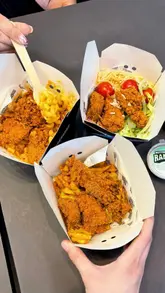 A promotional video for Sides showcasing their 'Chicken Variety Box' menu. The video features close-up shots of various chicken and side combinations, including waffle fries, mac and cheese, and rice, alongside clips of the digital ordering kiosk.