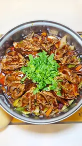 A vlog-style review of Simmer Huang in London, showcasing a variety of Chinese dishes including skewers, dumplings, pancakes, and a signature lamb chop simmer pot, along with mocktails.