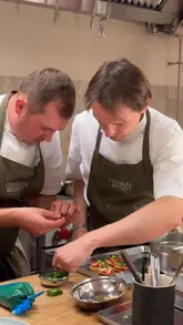 A behind-the-scenes montage of a photoshoot for a private chef, featuring the preparation, plating, and final presentation of high-end dishes and cocktails. The video highlights the attention to detail and professional service involved in the private dining experience.