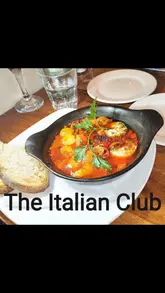 Here are a few options for your SEO alt text, depending on the image content:

**Option 1 (Focus on the meal):**
"Delicious spread of Italian pasta, fresh seafood, and bread at The Italian Club on Bold Street in Liverpool."

**Option 2 (Focus on the vibe):**
"Authentic Italian dining experience with pasta and king prawns at The Italian Club restaurant on Bold Street, Liverpool."

**Option 3 (Concise):**
"Table of authentic Italian dishes including spaghetti bolognese and fried calamari at The Italian Club, Liverpool."

**SEO Tip:** I included the restaurant name and location ("The Italian Club, Liverpool") as these are high-intent keywords that will help your image rank when people search for local Italian dining.