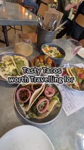 Here are a few options for your SEO alt text, depending on what the image specifically shows:

**Option 1 (Focus on the food layout):**
"A variety of delicious tacos, Mexican street corn, and vibrant salsas served at Tacquero restaurant in Nottingham."

**Option 2 (Focus on the variety):**
"Close up of colorful tacos, croquetas, and Mexican street corn on a table at Tacquero, Nottingham."

**Option 3 (Concise & descriptive):**
"Assorted Mexican tacos and street corn at Tacquero restaurant in Nottingham."

**SEO Tip:** I recommend including the location ("Nottingham") and the restaurant name ("Tacquero") as these are high-value keywords for local search discovery!