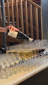 A short, energetic montage capturing an event at Mercato Metropolitano celebrating a partnership with the Friuli Venezia Giulia region. The video features shots of wine pouring, various Italian food items like prosciutto and frico, live music, and the bustling atmosphere of the venue.