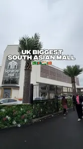 Here are a few options for your SEO alt text, keeping under the 125-character limit:

**Option 1 (Descriptive):**
Shoppers browsing clothing at the grand opening of Signature Mall, the UK’s biggest South Asian shopping centre in Bradford.

**Option 2 (Action-focused):**
Interior view of Signature Mall in Bradford, showcasing the UK’s largest South Asian fashion and lifestyle shopping hub.

**Option 3 (Concise):**
Visitors shopping for South Asian fashion at the new Signature Mall in Bradford, UK.