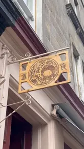 A video review of Pomelo in Edinburgh, featuring the creator's visit to try the spring menu. The video includes shots of the restaurant exterior, the cosy interior, the menu, and several dishes including banchan, salad, prawn toast, and noodles.