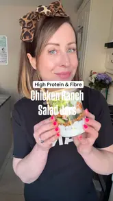 Layered buffalo chicken ranch salad jar with crispy chickpeas, feta, and fresh vegetables for healthy meal prep.
