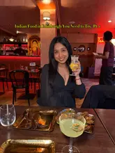 Here are a few options for your alt text, keeping it under 125 characters:

**Option 1 (Descriptive):**
Delicious South Indian food, including crispy starters, rich curries, and biryani at Tamil Teru restaurant in Edinburgh.

**Option 2 (Focus on atmosphere):**
A spread of flavourful South Indian dishes in the warm and cosy setting of Tamil Teru restaurant in Edinburgh.

**Option 3 (Concise):**
Table spread of authentic South Indian starters, curries, and biryani at Tamil Teru, a top Indian spot in Edinburgh.

**SEO Tip:** I recommend **Option 1** as it includes the specific location and the name of the restaurant, which helps search engines index your content for "Indian food Edinburgh.