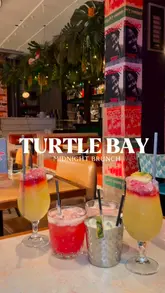 A promotional video for Turtle Bay's 'Midnight Brunch' featuring a montage of Caribbean-inspired dishes, cocktails, and the venue's interior atmosphere. The video highlights the late-night bottomless brunch offer, showcasing the food, drinks, and social setting.