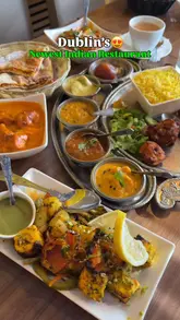 Here are a few options for your SEO alt text, keeping it under 125 characters:

**Option 1 (Descriptive & SEO-focused):**
North Indian non-veg thali, butter chicken, and stuffed paratha served at Red Chillies restaurant in Sandyford, Dublin.

**Option 2 (Action-oriented):**
A delicious North Indian feast including butter chicken and chilli paneer at Red Chillies restaurant in Dublin.

**Option 3 (Concise):**
Table spread of authentic North Indian food like butter chicken and thali at Red Chillies restaurant in Sandyford, Dublin.

**SEO Tip:** Including the restaurant name ("Red Chillies") and location ("Sandyford, Dublin") is the best strategy for local search visibility.