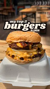 Here are a few options for your alt text, depending on how descriptive you want to be:

**Option 1 (Descriptive & SEO-focused):**
"A delicious double cheeseburger with melted cheese from Bleecker Burger, a top burger spot in London."

**Option 2 (Action-oriented):**
"Close up of a juicy Bleecker Burger cheeseburger, featuring premium beef and melted American cheese."

**Option 3 (Concise):**
"Bleecker Burger classic cheeseburger, one of the best burgers to eat in London."

**SEO Tip:** Always include the brand name (Bleecker Burger) and the main keyword (London burger) for the best results!
