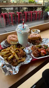 A review of the limited-time 'Spice Bag' menu at Meat Stack, featuring an Irish cheeseburger dip, salt and pepper chicken sandwich, spice bag fries, salt and pepper tenders, and a lucky charm milkshake.