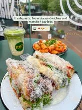 Here are a few options for your SEO alt text, keeping it under 125 characters:

**Option 1 (Focus on the food variety):**
Fresh pasta, chicken parm focaccia sandwich, and a matcha latte at Renata Pasta in Kargo Mkt, Manchester.

**Option 2 (Descriptive & punchy):**
A spread of Rigatoni Toscano, chicken focaccia sandwich, and matcha latte from Renata Pasta at Kargo Mkt.

**Option 3 (SEO-focused):**
Renata Pasta dishes including rigatoni, chicken parm sandwich, and matcha at Kargo Mkt Manchester.

**Recommendation:** Option 1 is generally the best for SEO as it clearly defines the items and the specific location.
