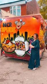 A short, music-backed reel showcasing a visit to the MCR Spuds food truck. The video features the exterior of the truck, the menu, and close-up shots of loaded baked potatoes being prepared and served.