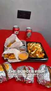 A promotional video for The Burger Firm's new location on Harrow Road, featuring close-ups of their smash burgers, loaded fries, and drinks, alongside shots of the venue's interior and exterior.