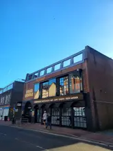 A clear, eye-level exterior shot of the Helch Market building in Winchester, showcasing the venue's facade and signage.