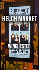 A vlog-style tour of the newly opened Helch Market food hall in Winchester. The creator walks through the venue, highlighting the different food stalls, the bar area, and the overall atmosphere, including a photo booth.