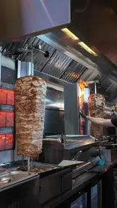 To provide you with the most accurate alt text, please **upload the image** or describe what is happening in it! 

However, assuming it is a photo of shawarma at @chachaedinburgh, here are a few options:

*   **Option 1 (Descriptive):** Delicious freshly carved chicken shawarma wrap served at Cha Cha Edinburgh.
*   **Option 2 (Action-oriented):** Close-up of a loaded shawarma wrap being prepared at Cha Cha in Edinburgh.
*   **Option 3 (SEO-focused):** Tasty Middle Eastern shawarma wrap from Cha Cha, a popular restaurant in Edinburgh city center.

**Tip:** Always ensure your alt text describes the visual content clearly so that visually impaired users know exactly what is in the image!