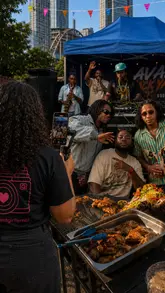 A fast-paced, music-driven montage showcasing a lively outdoor event at Avan Lounge. The video features live performances, including a saxophonist and a fire breather, alongside shots of the crowd dancing and plates of food, effectively communicating the venue's energetic atmosphere.