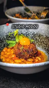 A visually appealing, polished showcase of a 5-course tasting menu at Studio Modou in Finnieston, Glasgow, highlighting the intimate atmosphere and high-quality plating of the dishes.