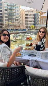 A short, aesthetic montage showcasing an afternoon tea service at The Anchor, Chelsea Harbour. The video features slow, deliberate shots of the terrace setting overlooking the harbour, the tiered afternoon tea stand, close-ups of sandwiches, scones, and delicate pastries, and the pouring of tea.