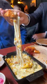 A short, punchy review of a new Korean chicken restaurant in Dublin, featuring close-up shots of various dishes like Korean fried chicken, dumplings, and corn cheese, alongside glimpses of the venue's interior.