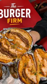 A short, punchy review of The Burger Firm, featuring close-ups of their loaded burgers and fries.