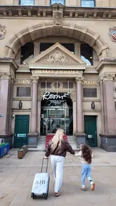 A family-focused vlog showcasing a stay at Roomzzz Manchester, highlighting the apartment's amenities, the central location, and nearby family-friendly activities.