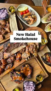 A high-quality, overhead flat-lay shot showcasing a generous spread of American-style BBQ dishes, including smoked meats, ribs, and sides, presented on wooden boards.