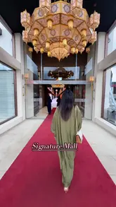 A creator takes viewers on a tour of the new Signature Mall in Bradford, highlighting the various retail shops selling South Asian fashion, jewelry, and accessories, followed by a visit to the food court to sample several dishes.