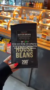 The video promotes a 'Coffee Amnesty' campaign at 200 Degrees coffee shop, where customers can exchange old instant coffee for a bag of fresh beans. It features quick shots of the amnesty bin, the coffee shop interior, and various food items like sandwiches and cake.
