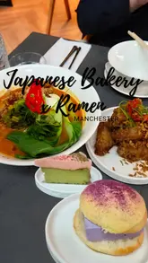 A short, punchy reel featuring a visit to Hakkapo and Nagomi Cloud Bakery in Manchester. The video highlights a variety of items, including dan dan noodles, crispy chicken wings, and various Japanese-style bakery goods, using quick cuts to maintain viewer interest.