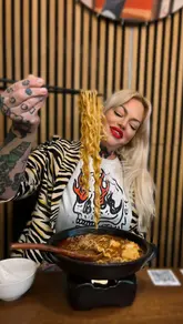 A creator visits Pot Pot Malatang in Bristol, showcasing the menu, the interior, and a variety of dishes including fried fish skin, chicken wings, skewers, and a customizable hot pot bowl.