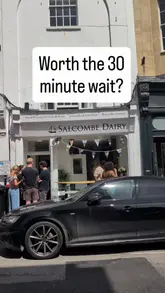 This video provides a quick, first-person perspective on the opening weekend of a new Salcombe Dairy ice cream parlour in Clifton, Bristol. It documents the queue, the menu options, the scooping process, and the final product, offering a candid look at the experience.