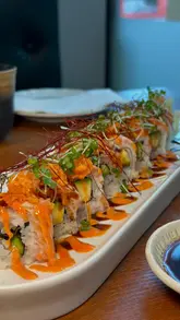 A short, aesthetic montage of high-end Japanese dishes including sushi rolls, pan-seared scallops, and black cod, filmed at Nagoya in Canary Wharf.