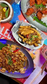 A couple visits Thaikhun for a date night, showcasing the restaurant's vibrant interior, new menu items, and cocktail offerings.