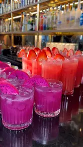 A short, montage-style video showcasing a selection of cocktails, a mixed appetizer platter, various curries with rice, and a chocolate dessert at Zouk restaurant. The video focuses on the food and drink presentation with slow, stable pans and cuts.