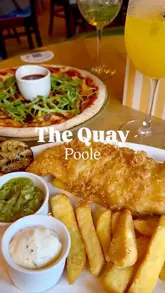 A promotional montage showcasing The Quay in Poole, highlighting their food menu, cocktail selection, and entertainment facilities including shuffleboard and sports viewing.