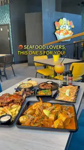 A promotional video for Shrimp & Co in Brixton, featuring a variety of seafood dishes including lobster, prawns, and seafood boils, alongside sides like chicken wings and cheesy dips.