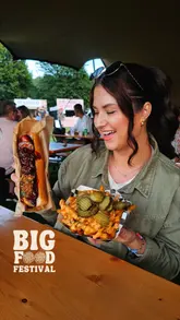 A vibrant montage video showcasing various food vendors, live music, and the general atmosphere at the Big Food Festival held at Gnoll Country Park.