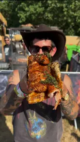 A high-energy vlog-style video showcasing the food and atmosphere at the State Fayre BBQ and music festival. The creator samples various BBQ dishes from different vendors and highlights the festival's Americana-inspired vibe, music, and activities.