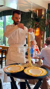 A short, aesthetic montage showcasing the interior, service, and food offerings of Barbarella in Canary Wharf. The video features slow, smooth pans of the dining room, a waiter serving pasta, and close-ups of cocktails and appetizers, set to music.